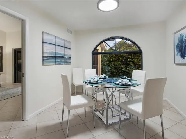 Dining room with light tile patterned floors