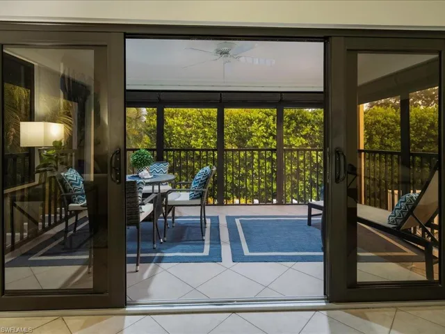 Doorway featuring tile patterned flooring