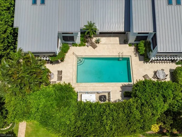 View of subject property featuring a pool