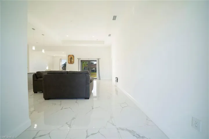 Living room featuring a tray ceiling