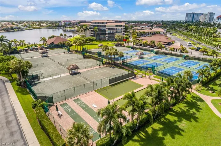 Birds eye view of property with a water view