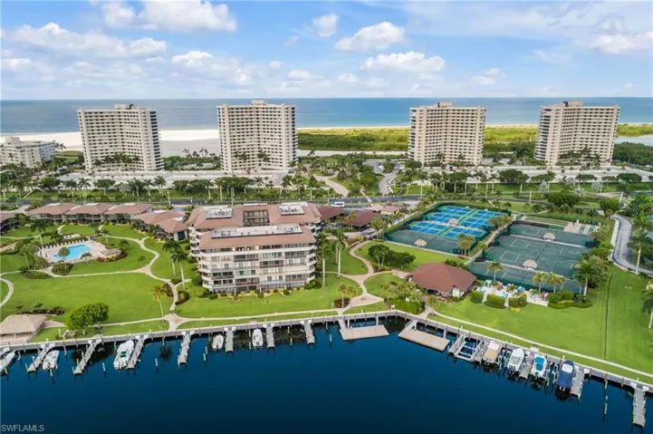 Birds eye view of property with a water view