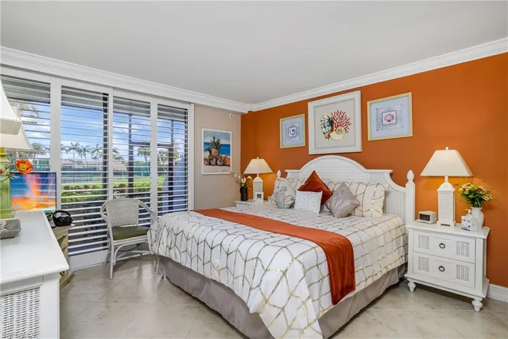 Tiled bedroom with ornamental molding