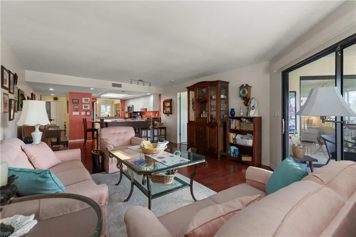 Living area with wood finished floors and baseboards