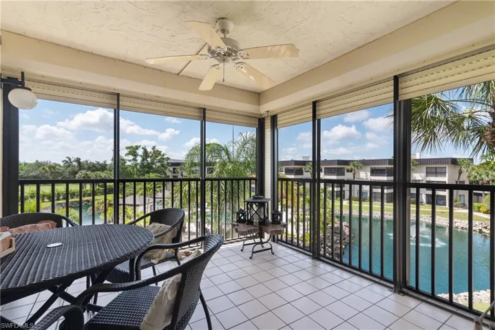 Sunroom featuring a ceiling fan