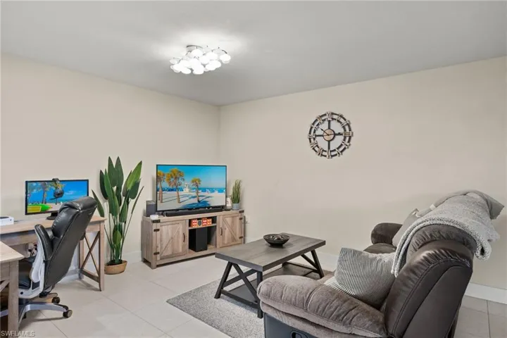 Living room featuring light tile patterned floors