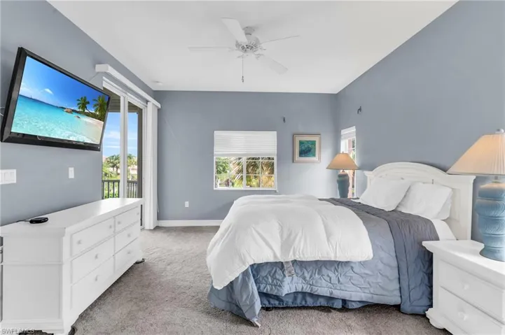 Bedroom with light carpet and ceiling fan