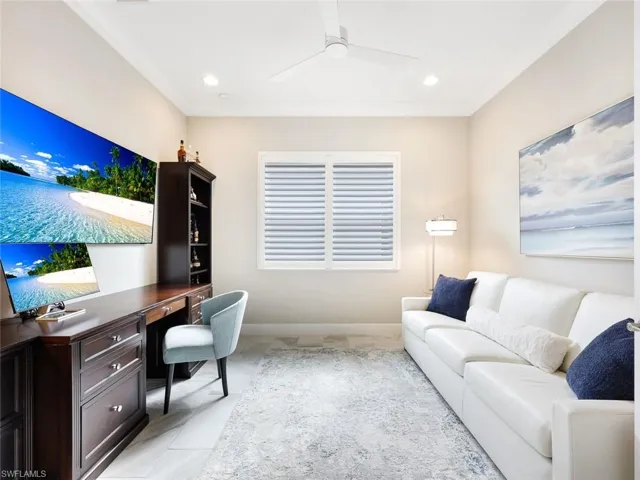 Home office featuring ceiling fan and crown molding