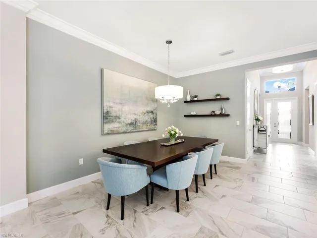 Dining area with ornamental molding