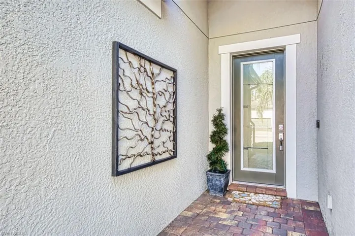 Property entrance with stucco siding