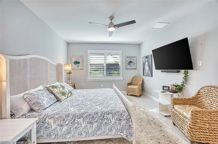 Bedroom featuring baseboards and ceiling fan