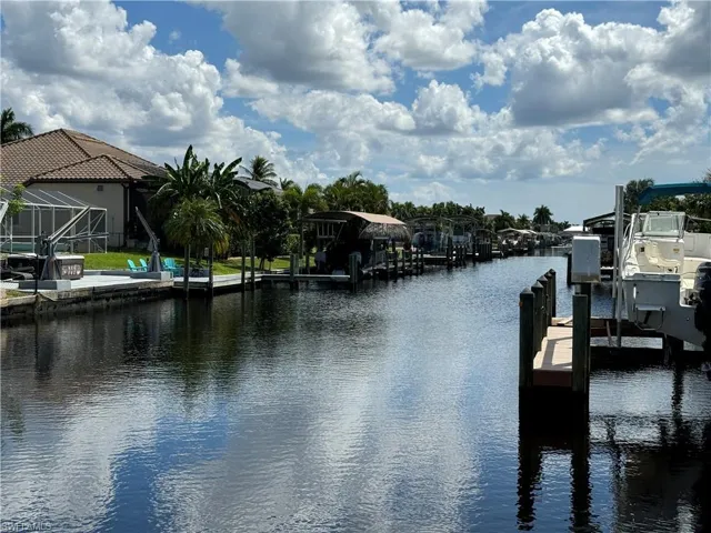 Dock area featuring a lanai and a water view