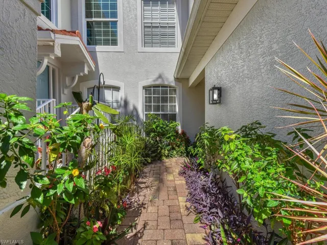 Gorgeous Tropical Landscaping Lining Private Front Entry