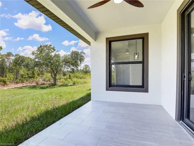 View of patio featuring ceiling fan