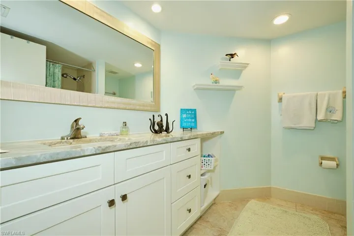 Bathroom featuring recessed lighting, curtained shower, visible vents, vanity, and tile patterned floors