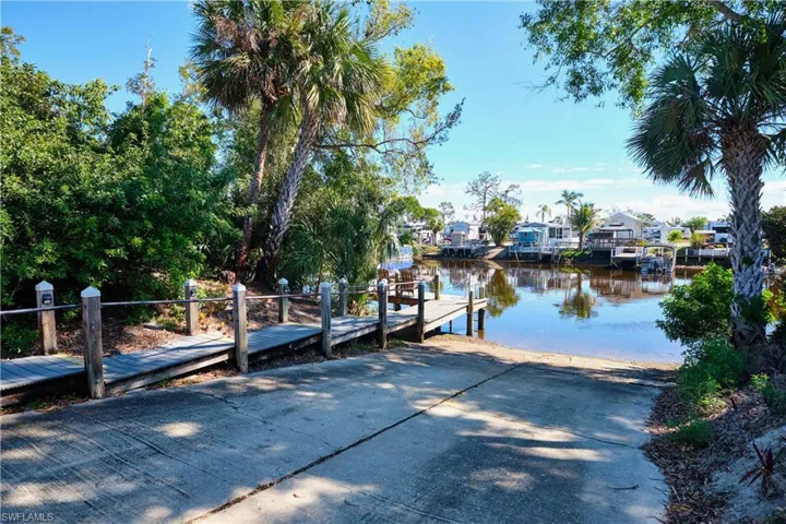 View of dock with a water view and a residential view
