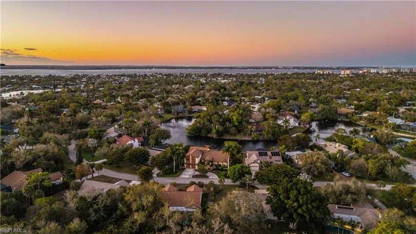 Aerial view of residential area with a nearby body of water
