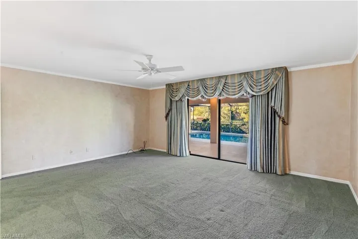 Master bedroom featuring ceiling fan and crown molding