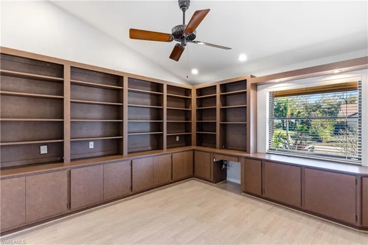 master office, lofted ceiling, ceiling fan, light wood-style flooring, and recessed lighting