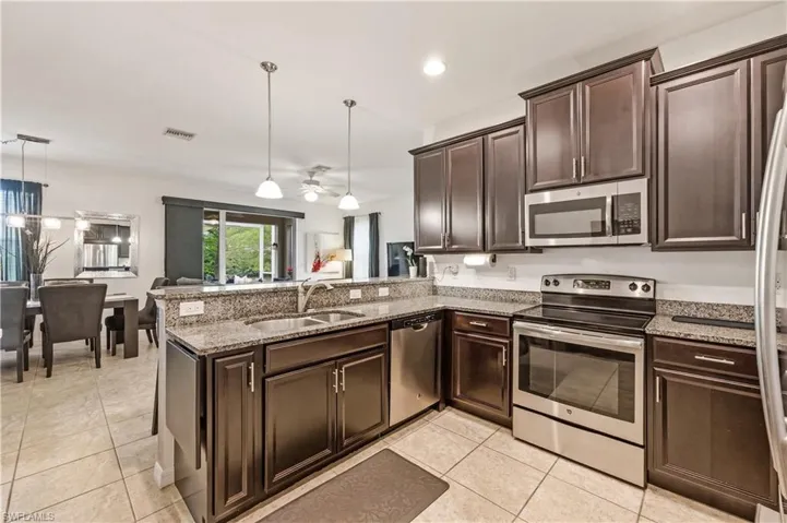 Kitchen with stainless steel appliances (refrigerator, oven, microwave and dishwasher)