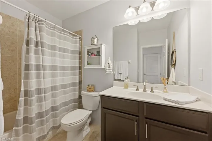 Full bathroom with tub and single vanity