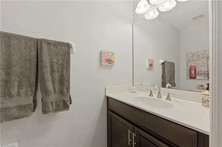 Half bathroom in entry hallway