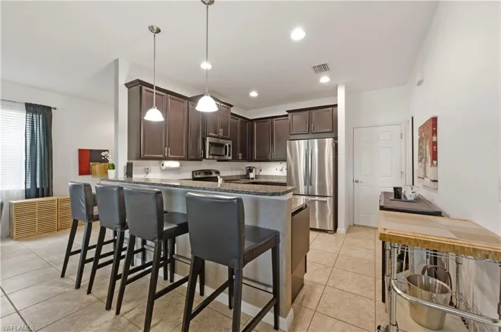 Kitchen with peninsula and barstools