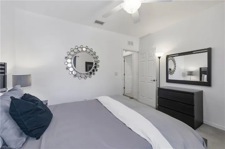 Guest bedroom with queen size bed, dresser and nightstands