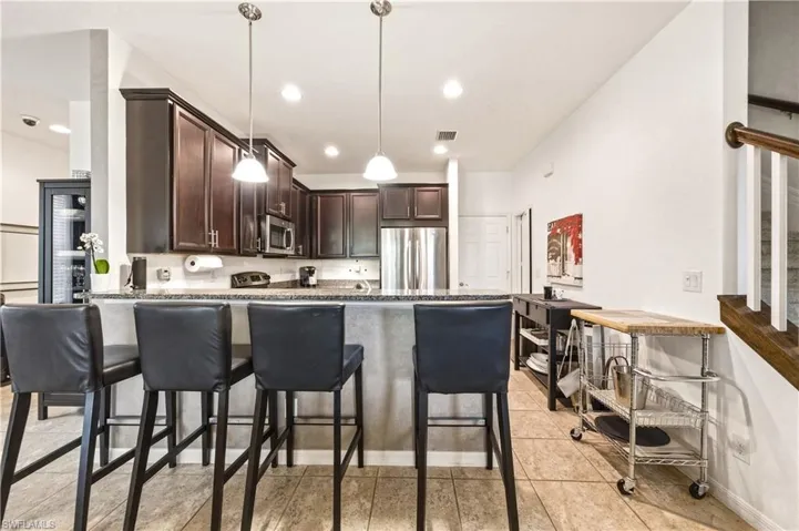 Kitchen with peninsula and barstools