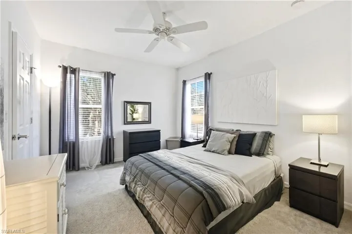 Guest bedroom with queen size bed, dressers and nightstands