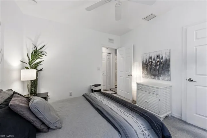 Guest bedroom with queen size bed, dressers and nightstands