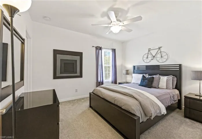 Guest bedroom with queen size bed, dresser and nightstands