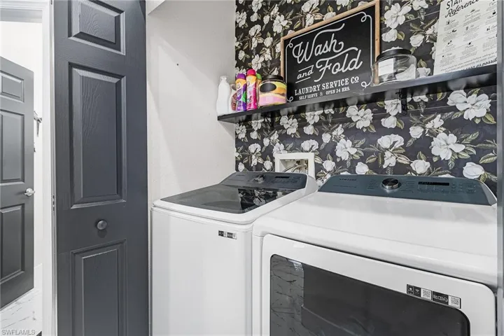 Laundry room featuring independent washer and dryer