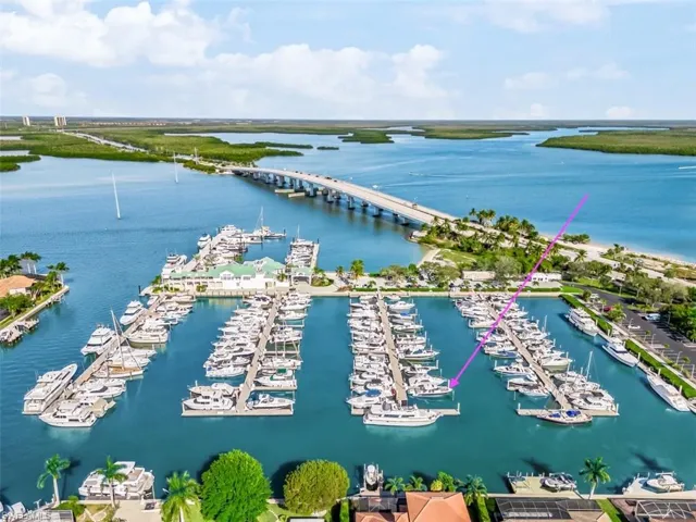 Aerial view of a nearby body of water and numerous boat docks