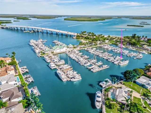 Drone / aerial view of a marina and a nearby body of water