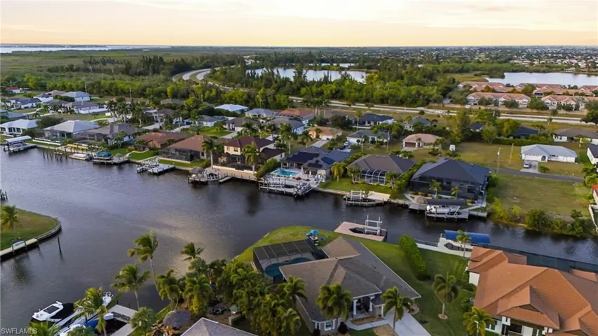 Aerial perspective of suburban area with a nearby body of water