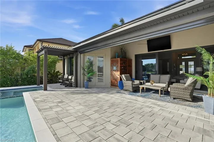 View of patio / terrace featuring french doors, an outdoor pool, a pergola, and an outdoor living space