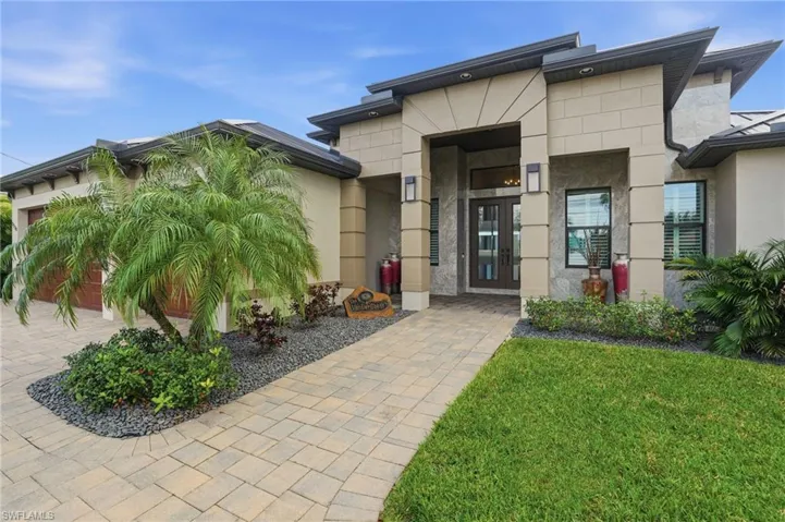 Double door entry with covered porch area.
