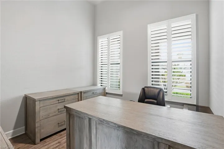 Office area with light wood finished floors and baseboards