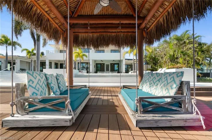 Deck featuring a gazebo and ceiling fan