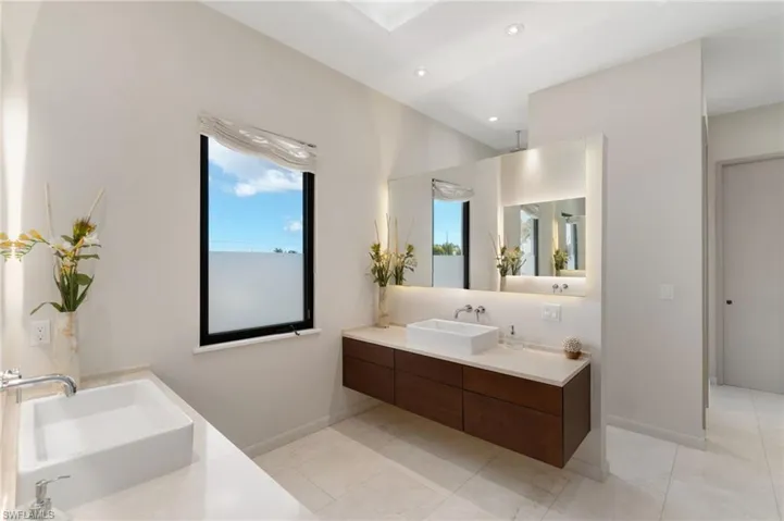 Bathroom featuring tile patterned flooring and vanity