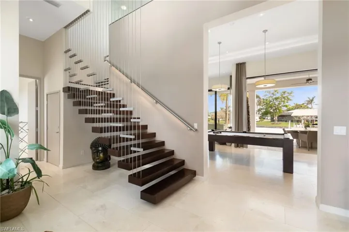 Staircase featuring billiards