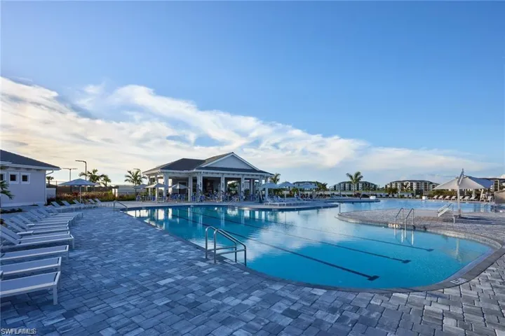 Community pool featuring a patio
