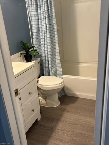 Full bath with vanity, tile floors, and shower / bathtub combination