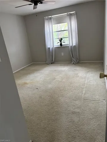 Carpeted Master Bedroom with a ceiling fan