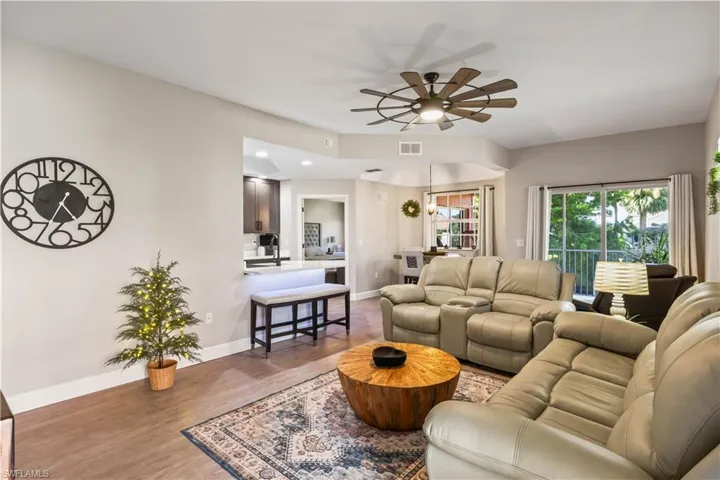 Bright and spacious open-concept living area with natural light and updated finishes—perfect for relaxing or entertaining.