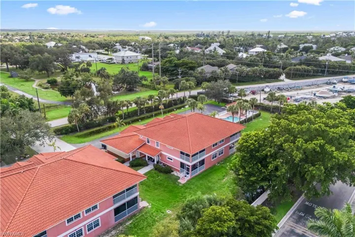 An aerial look at the beautifully maintained grounds, complete with community pool, boat ramp, and ample green space.
