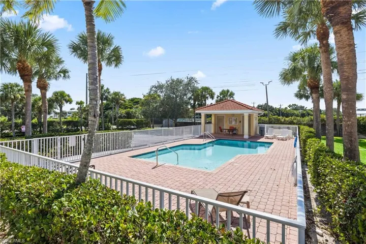 Inviting community pool just steps from your front door—perfect for sunny Florida days.