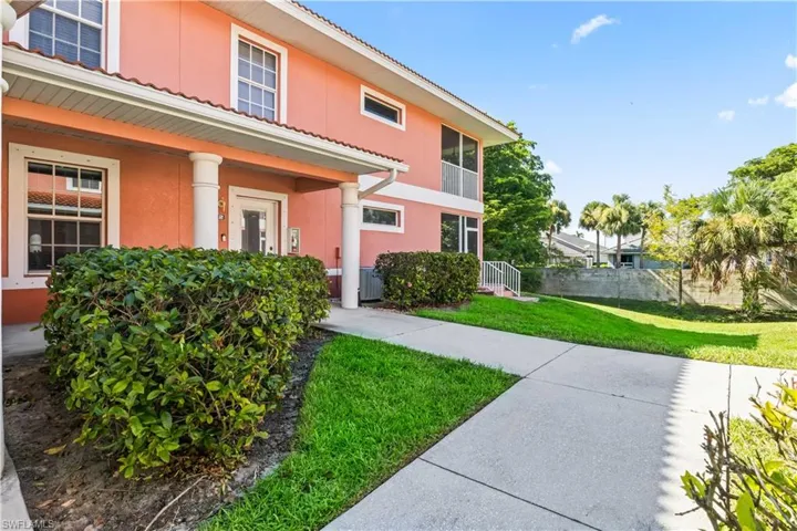 A peaceful, well-kept path leads you to the front door of this charming villa.