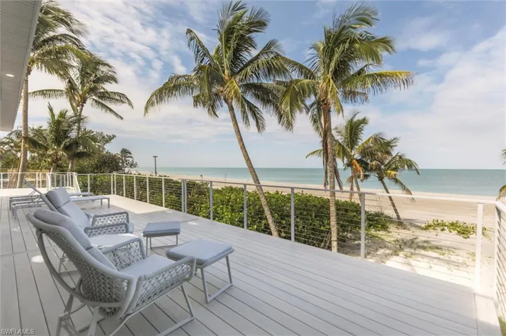 Wooden terrace featuring a water view